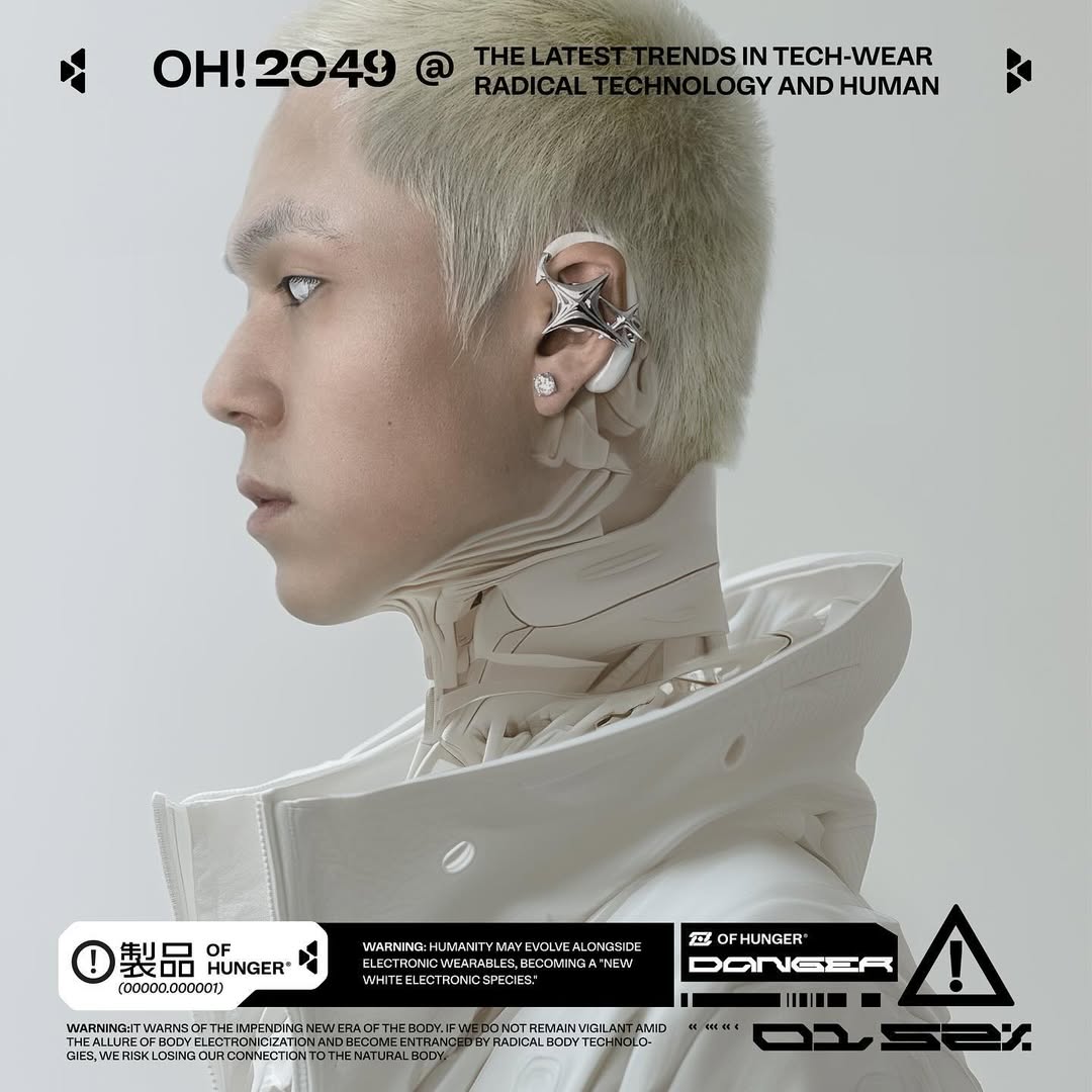 Blond Sentinel in white with a biomechanical neck and silver ear wearable