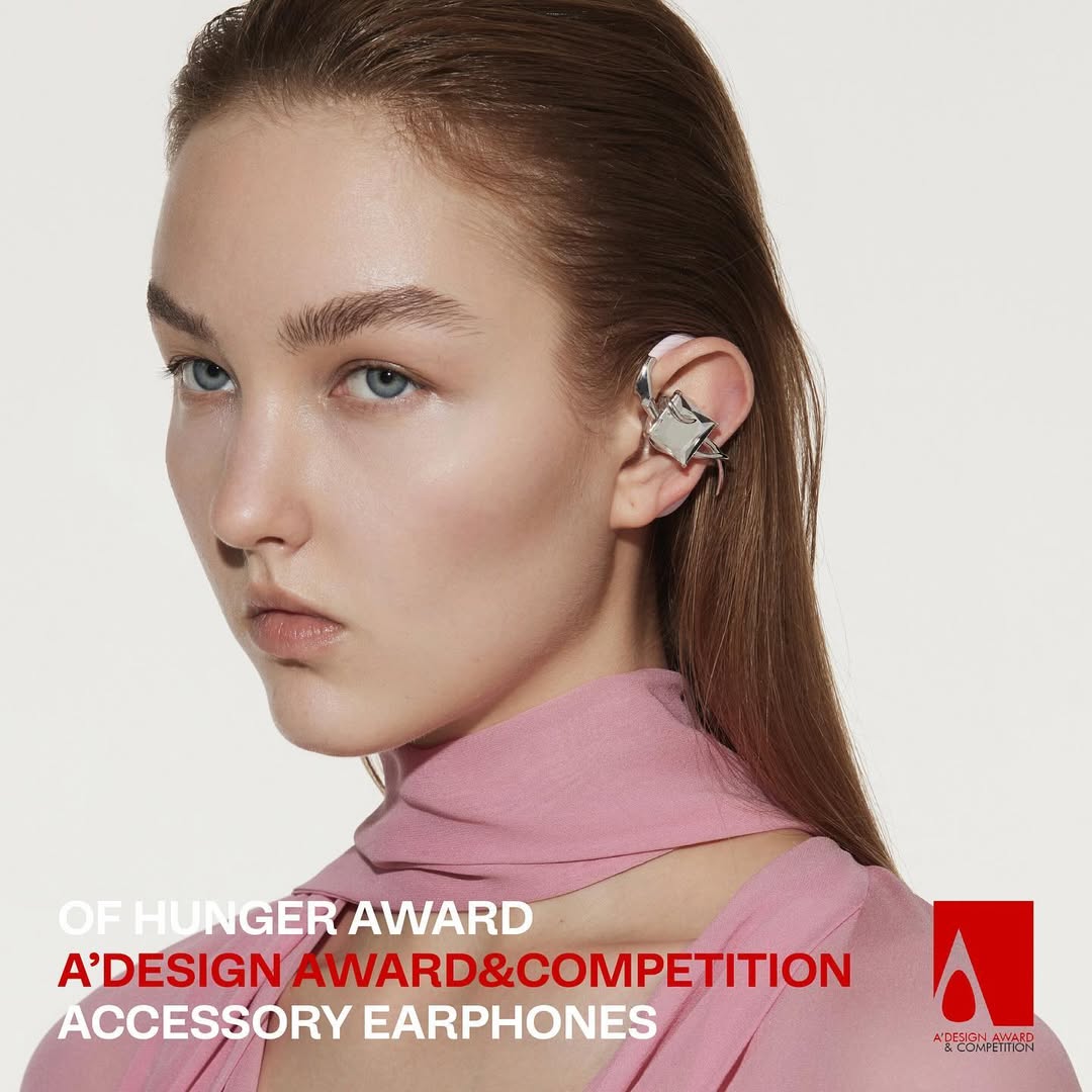 Model in pink wearing NEBULA beside an A’ Design award mark