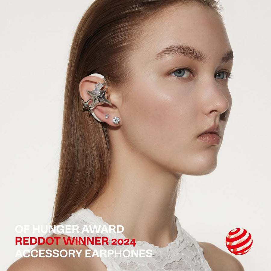 Profile portrait wearing silver NEBULA with a Red Dot award mark