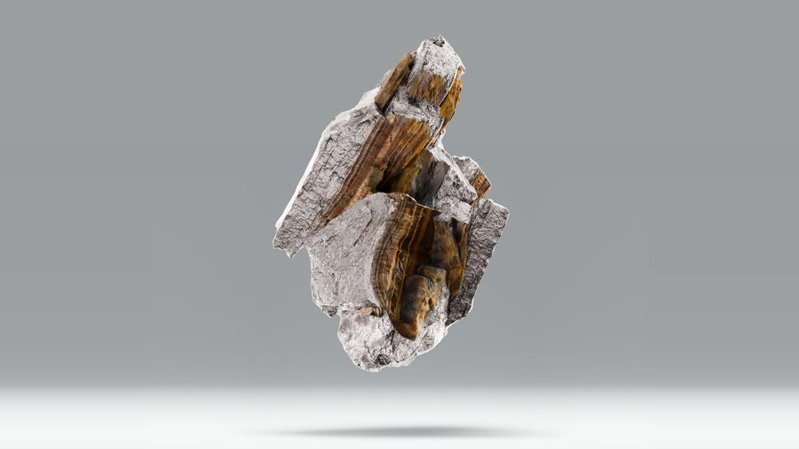 Tiger's eye stone with golden brown bands floating against a soft gray background