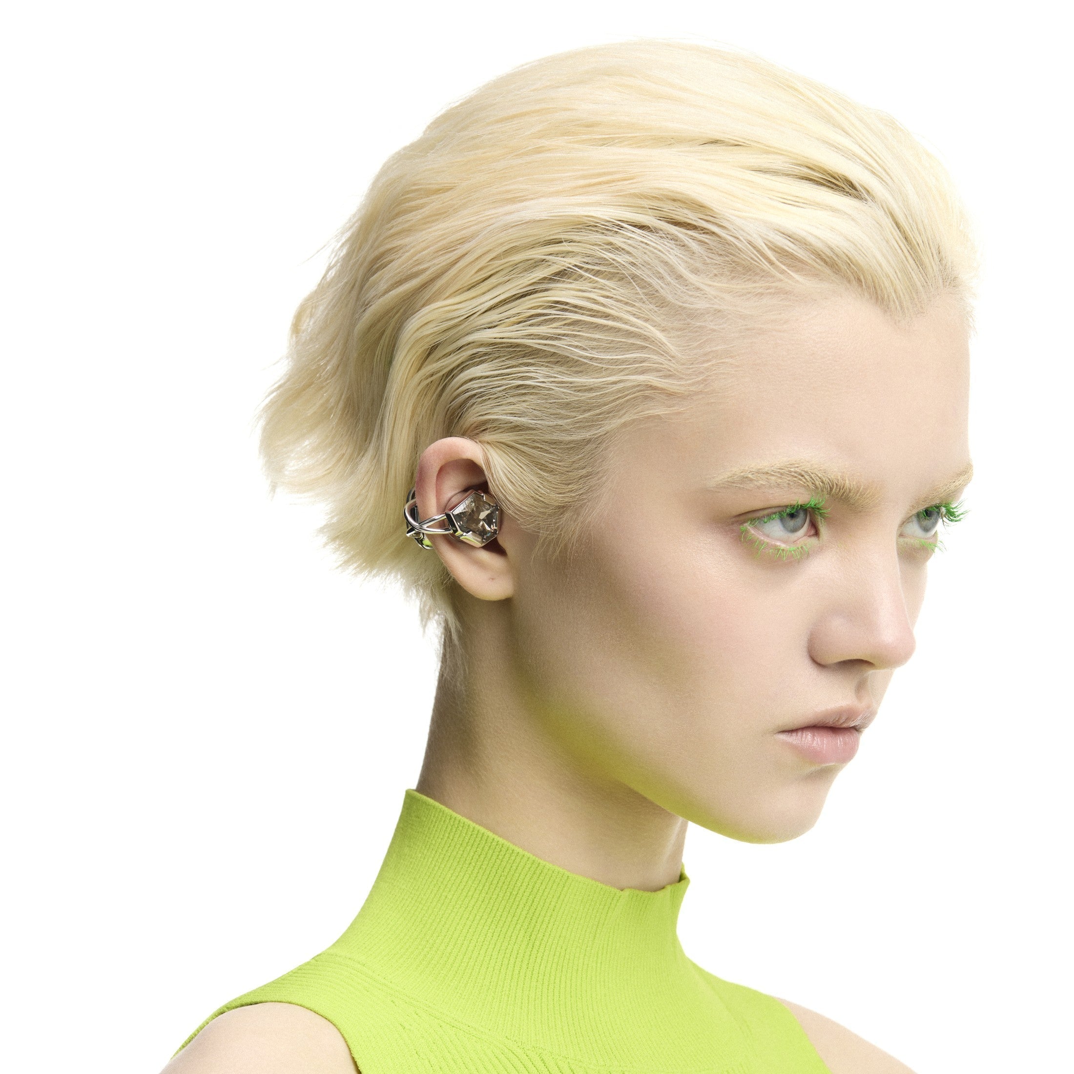 Single visible OF HUNGER Gray Zircon earphone styled as an asymmetric ear statement