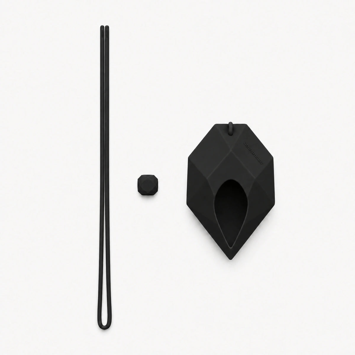 Dark Matter Black EARPHONE CASE, three-piece accessory layout with the long cord, silicone adjuster and faceted case on white