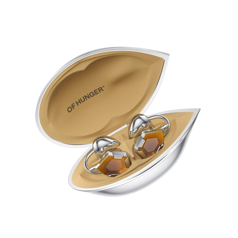Tiger's Eye with its charging case at a 30-degree angle